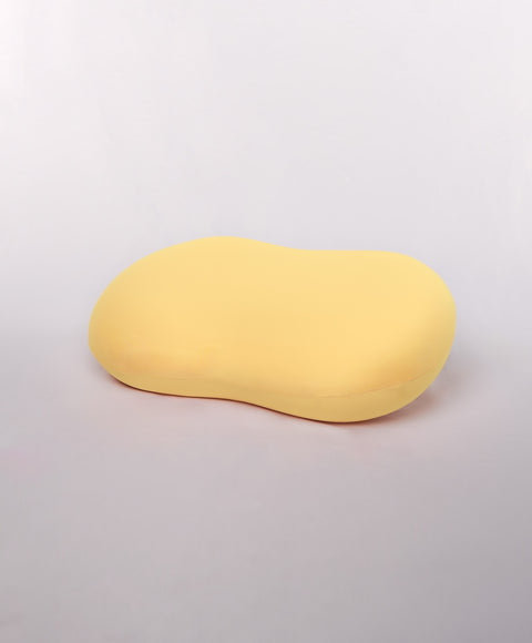 Yellow oval object on a light gray background